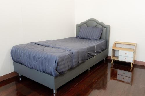 Ένα ή περισσότερα κρεβάτια σε δωμάτιο στο 2B Cozy Hostel ตรัง
