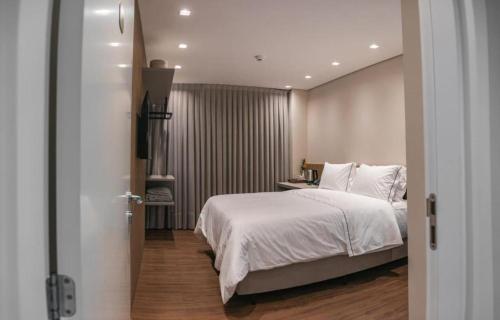 Cama ou camas em um quarto em Village Du Lac Hotel