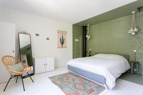 Postel nebo postele na pokoji v ubytování La maison du palefrenier