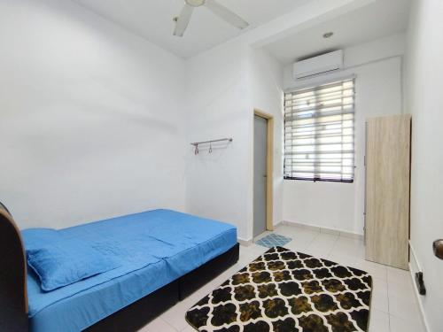 Ένα ή περισσότερα κρεβάτια σε δωμάτιο στο Indah Damai Homestay