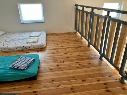 a room with a bed and a stair case at בריזה במדבר in Idan