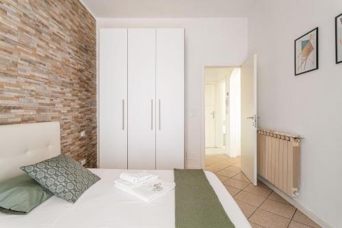 En eller flere senge i et værelse på “Sui tetti di Pietra” Appartamento Centro Storico