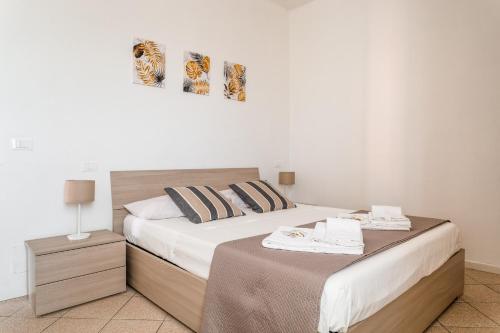 En eller flere senge i et værelse på “Sui tetti di Pietra” Appartamento Centro Storico