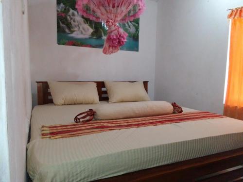 A bed or beds in a room at Isindu Holiday Home