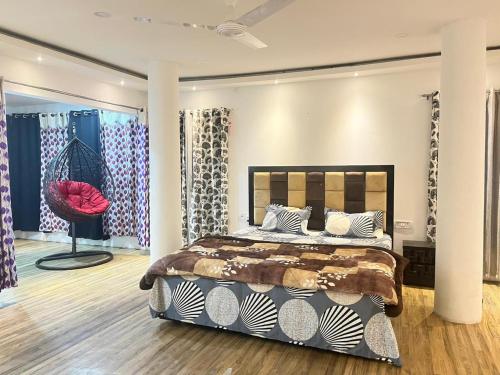 a bedroom with a bed in a room at Move Inn- The suite in Dibrugarh