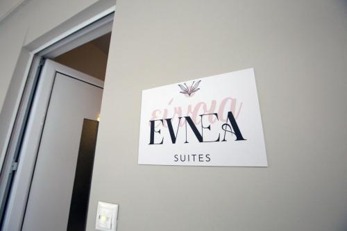 a sign on a wall next to a door at EVNEA in Nafplio
