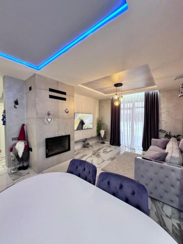 a large living room with a bed and a couch at Новий будинок для Вашого чудового відпочинку поряд Київ in Kyiv