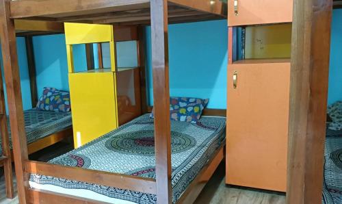 a couple of bunk beds in a room at Himalayas Youth Hostel Kempty Mussoorie in Mussoorie