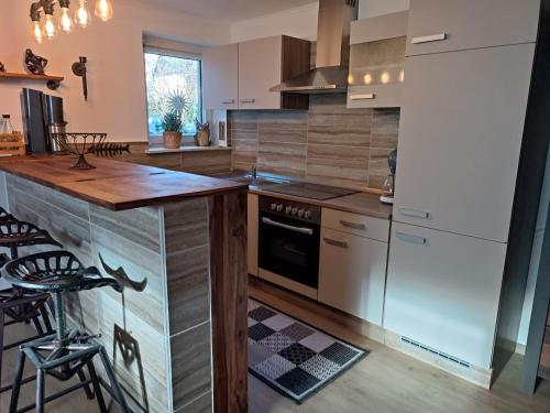 a kitchen with white appliances and a counter top at Ferienwohnung Ankerplatz Züssow in Züssow