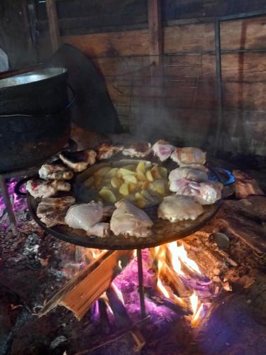 a grill with a bunch of food on it at CASA LAVINIA CRASNA GORJ in Crasna