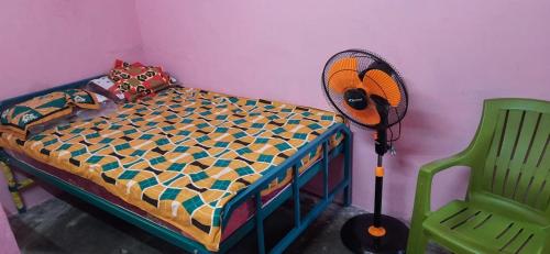 Posteľ alebo postele v izbe v ubytovaní Lakshmi Home Stay