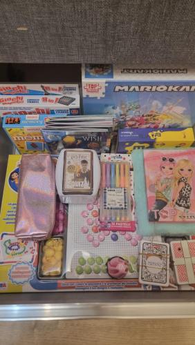 a group of toys are laid out on a table at New Living Milano in Gorgonzola
