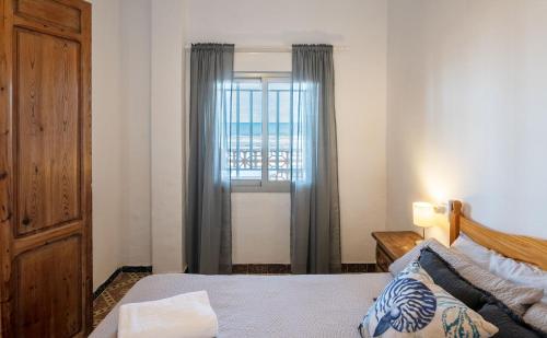 Katil atau katil-katil dalam bilik di Beachfront house
