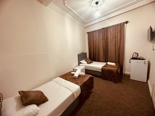 Ένα ή περισσότερα κρεβάτια σε δωμάτιο στο Konak Otel Suriçi