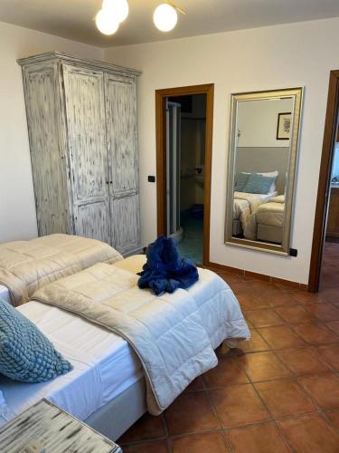 a bedroom with two beds and a mirror at Seacliff Heaven - De Vivo Realty Positano in Arola