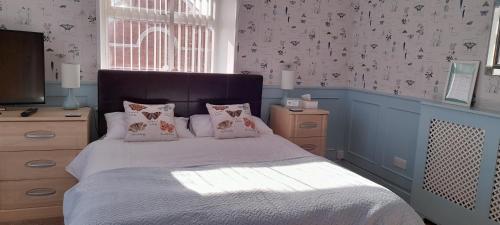 Ένα ή περισσότερα κρεβάτια σε δωμάτιο στο Waverley B & B