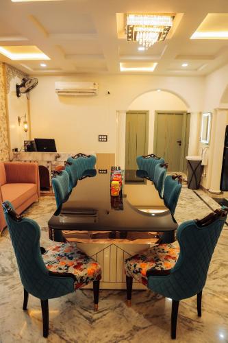 a living room with a table and chairs at Anirudh Homestay in Agra
