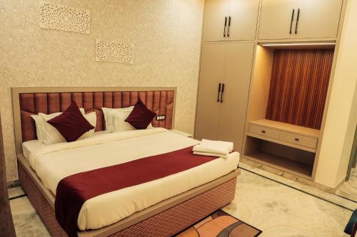 a bedroom with a large bed in a room at Anirudh Homestay in Agra