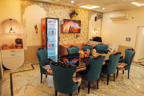 a dining room with a table and chairs at Anirudh Homestay in Agra