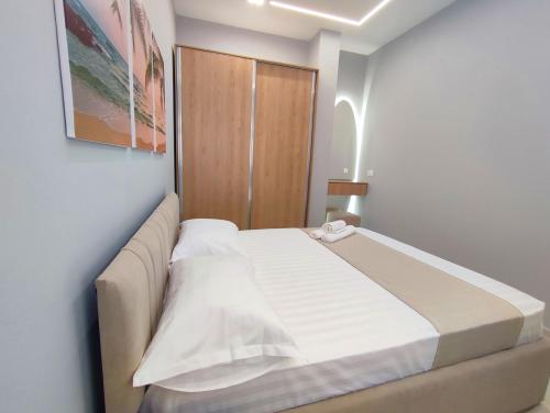 Łóżko lub łóżka w pokoju w obiekcie BP Beach Apartment