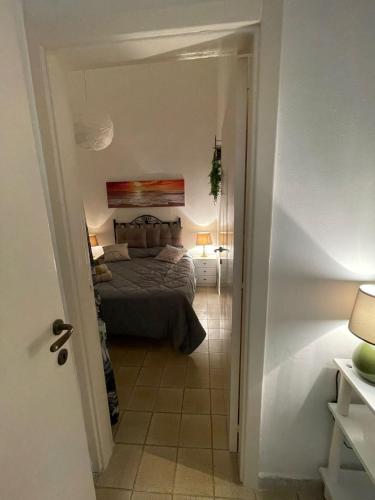 a bedroom with a bed in a room at “Vistamare” in Torre rinalda