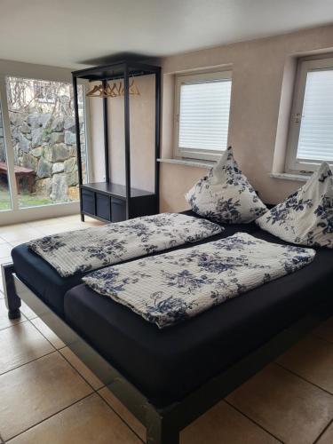 a bed with two pillows on it in a bedroom at Gästehaus Mama in Rust