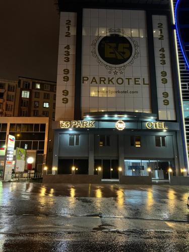 a parking lot in front of a building at night at E5 PARK OTEL in Esenyurt