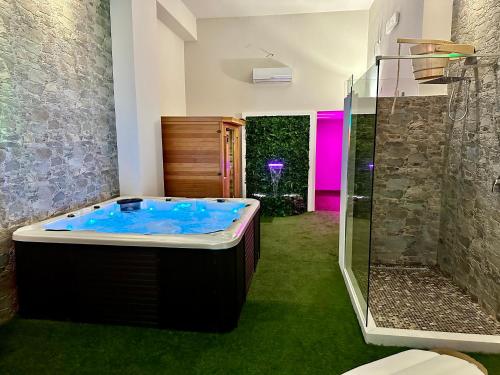 a bathroom with a large tub and a shower at Sicily in Love - Rooms & Breakfast in Taormina