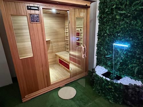 a shower with an aquarium in a room at Sicily in Love - Rooms & Breakfast in Taormina