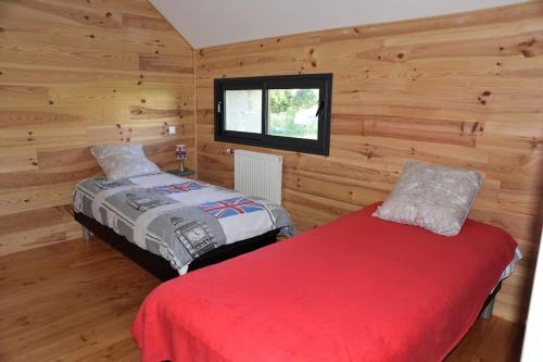 Postel nebo postele na pokoji v ubytování Gîte à la ferme, au coeur du Mené