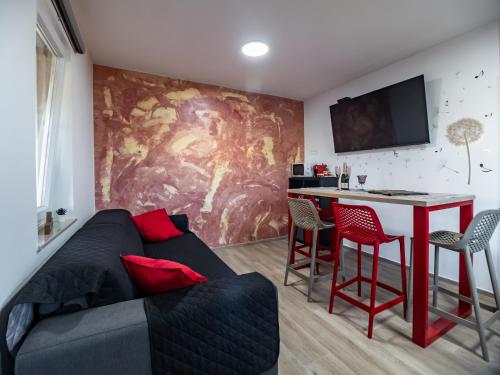 a living room with a couch and a table at Brojdi in Labin