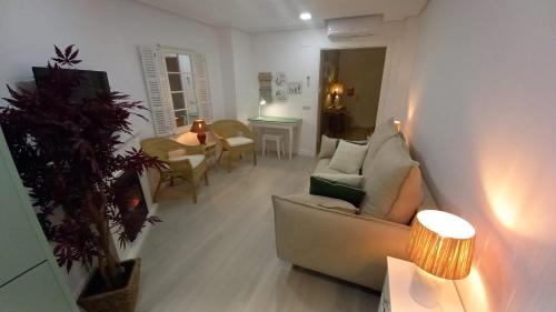 a living room with a couch and a table at El rinconet in Partida de La Cañada