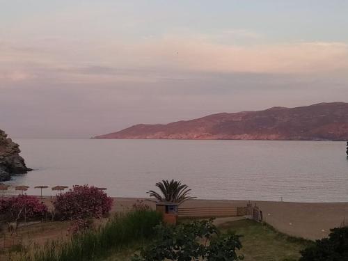 a view of a large body of water with mountains at Vitali sea house I in Vitálion