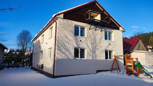 a house that is being built in the snow at Dom Šumiac - prízemie in Šumiac