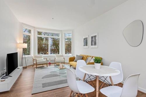 a living room with a table and a couch at Belltown's Flower Moon, near The Space Needle in Seattle