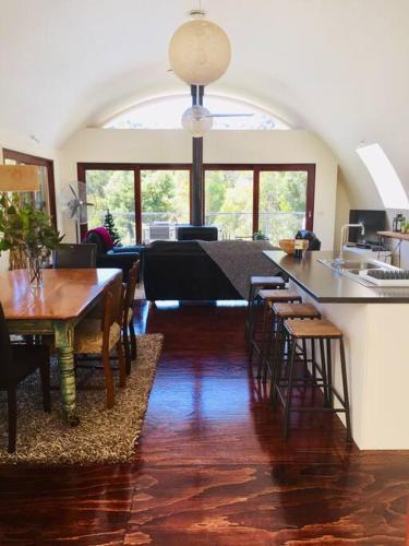 a kitchen and dining room with a table and chairs at Cocoon House in Newbury
