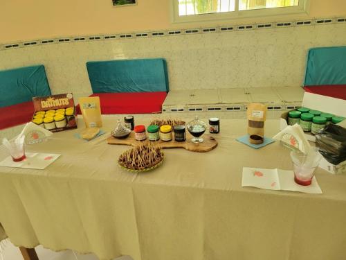 a table with some food and drinks on it at Garden12 Outdoor & More in Douz