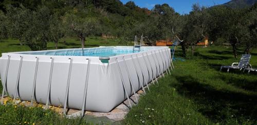 a large white tub sitting in a field at Agricampeggio Borgo Agna in San Giustino Valdarno