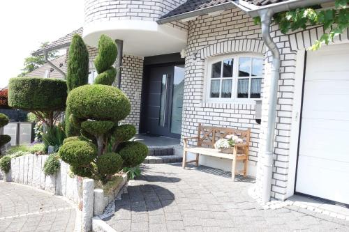a front door of a house with a cactus at FEWO EMMA in Overath