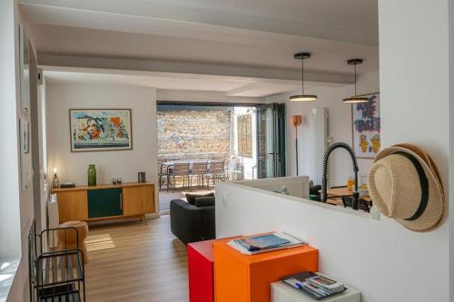 a living room with a couch and a table at L'appel du Large - Plage - Vue mer in Sainte-Adresse