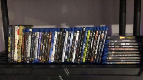 a shelf with a bunch of dvds at Uyuca Vista Family Villa in Tegucigalpa