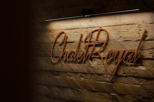 a brick wall with a sign that says amazon at Chalet Royal in Sinaia