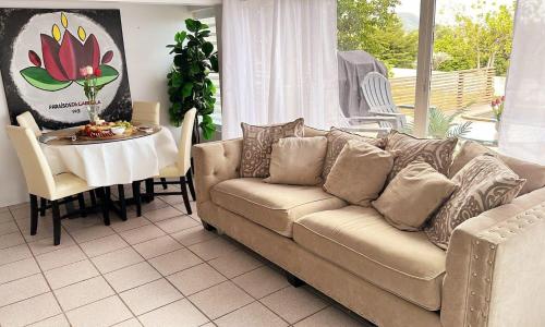 a living room with a couch and a table at PARAISOS DE GABRIELA in Villalba