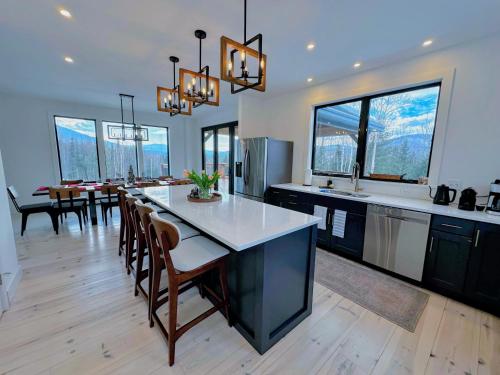 a kitchen and dining room with a table and chairs at 2M New rustic contemporary home with stunning views, great amenities and perfect private location. in Franconia