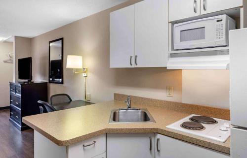 a kitchen with a sink and a microwave at Extended Stay America Suites - Philadelphia - Bensalem in Bensalem