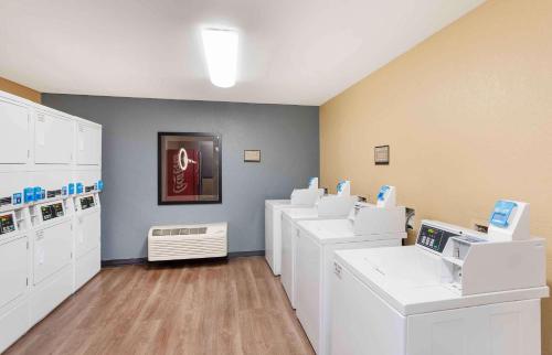 a laundry room with white washers and dryers at Extended Stay America Suites - Philadelphia - Bensalem in Bensalem
