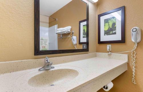 a bathroom with a sink and a mirror at Extended Stay America Suites - Minneapolis - Airport - Eagan - South in Eagan