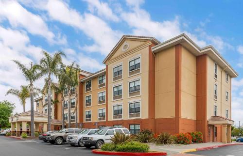 a large building with cars parked in a parking lot at Extended Stay America Premier Suites - Union City - Dyer St in Union City