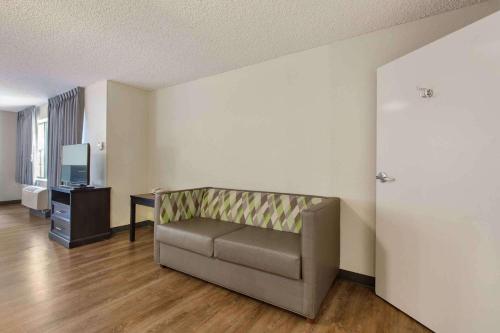 a living room with a couch and a television at Extended Stay America Premier Suites - Union City - Dyer St in Union City