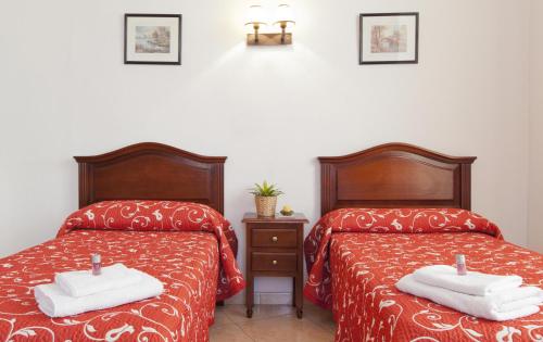 Ένα ή περισσότερα κρεβάτια σε δωμάτιο στο Hostal Condestable